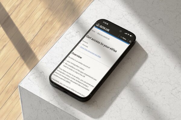 Phone on a marble table showing an application to switch to an eVisa