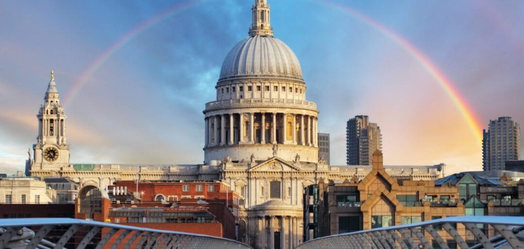 To discuss the 'Residence' aspect of this tax guide for Hong Kong residents moving to the UK, an image of St Paul's Cathedral in London can be seen. The photo is taken from the other end of the Millennium Bridge, and a rainbow can be seen in the background, encircling the cathedral. 