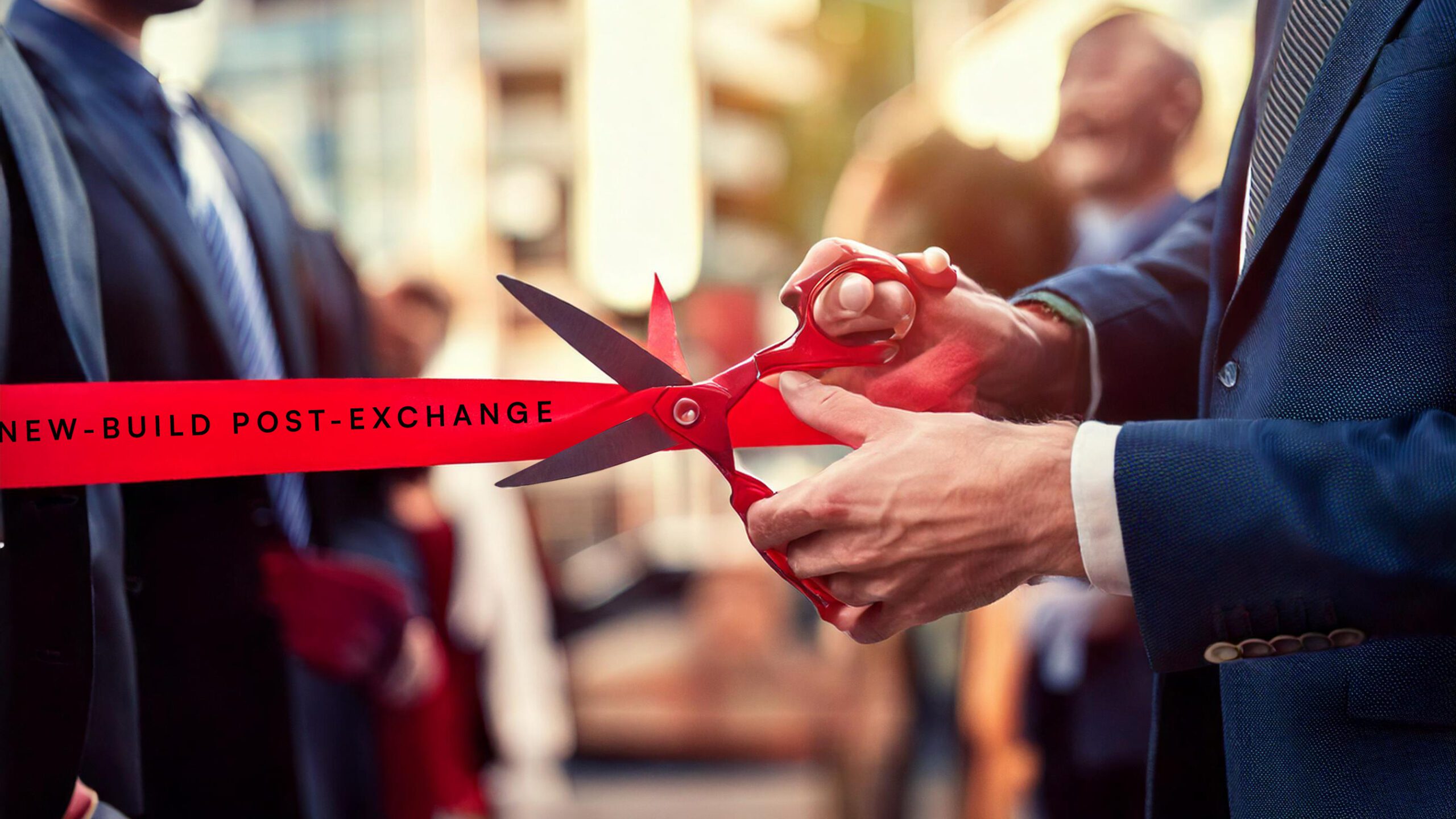 A new-build property based in London opening ceremony. A red ribbon that reads "new-build post-exchange". Red scissors in the process of cutting the ribbon
