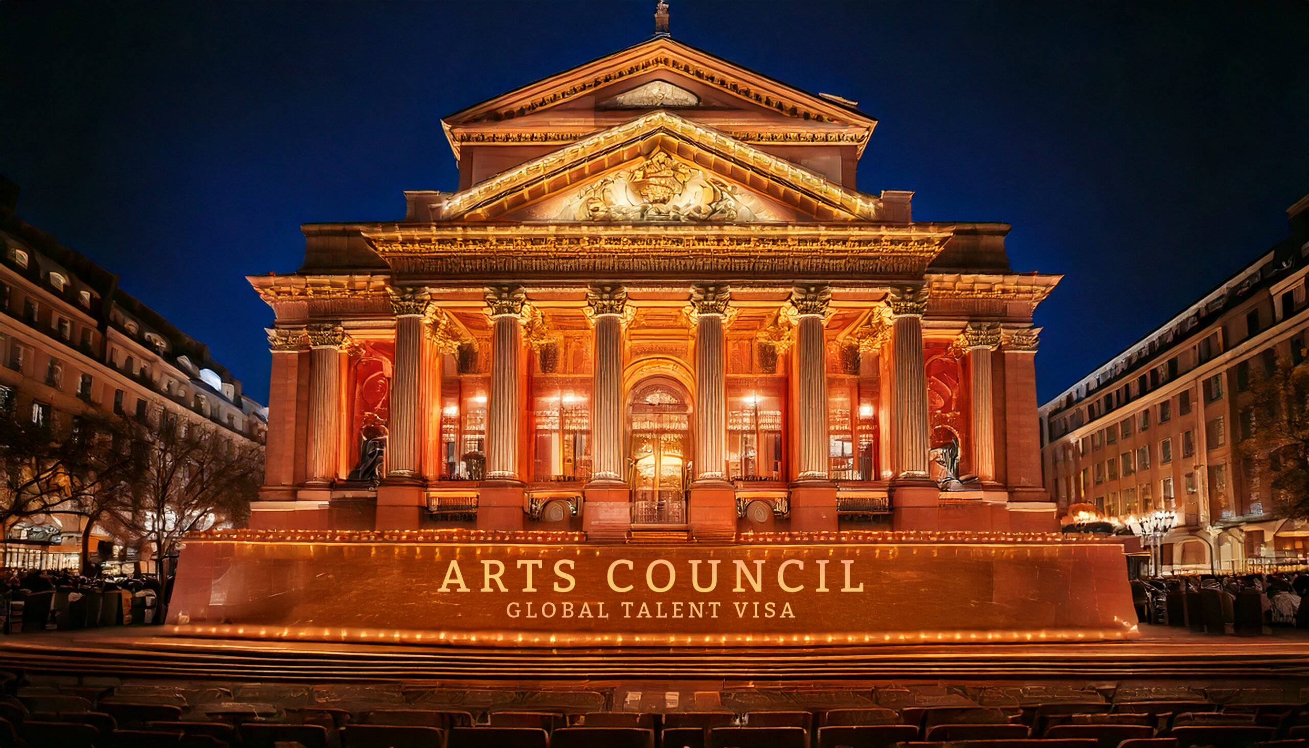 Illuminated neoclassical building at night with 'Arts Council - Global Talent Visa' displayed, representing the process of securing Arts Council England endorsement for the UK Global Talent Visa for artists, creatives, and cultural professionals.