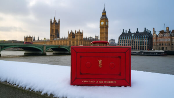 The Chancellor's red box sits opposite the snowy houses of parliament, representing the upcoming Winter Budget.