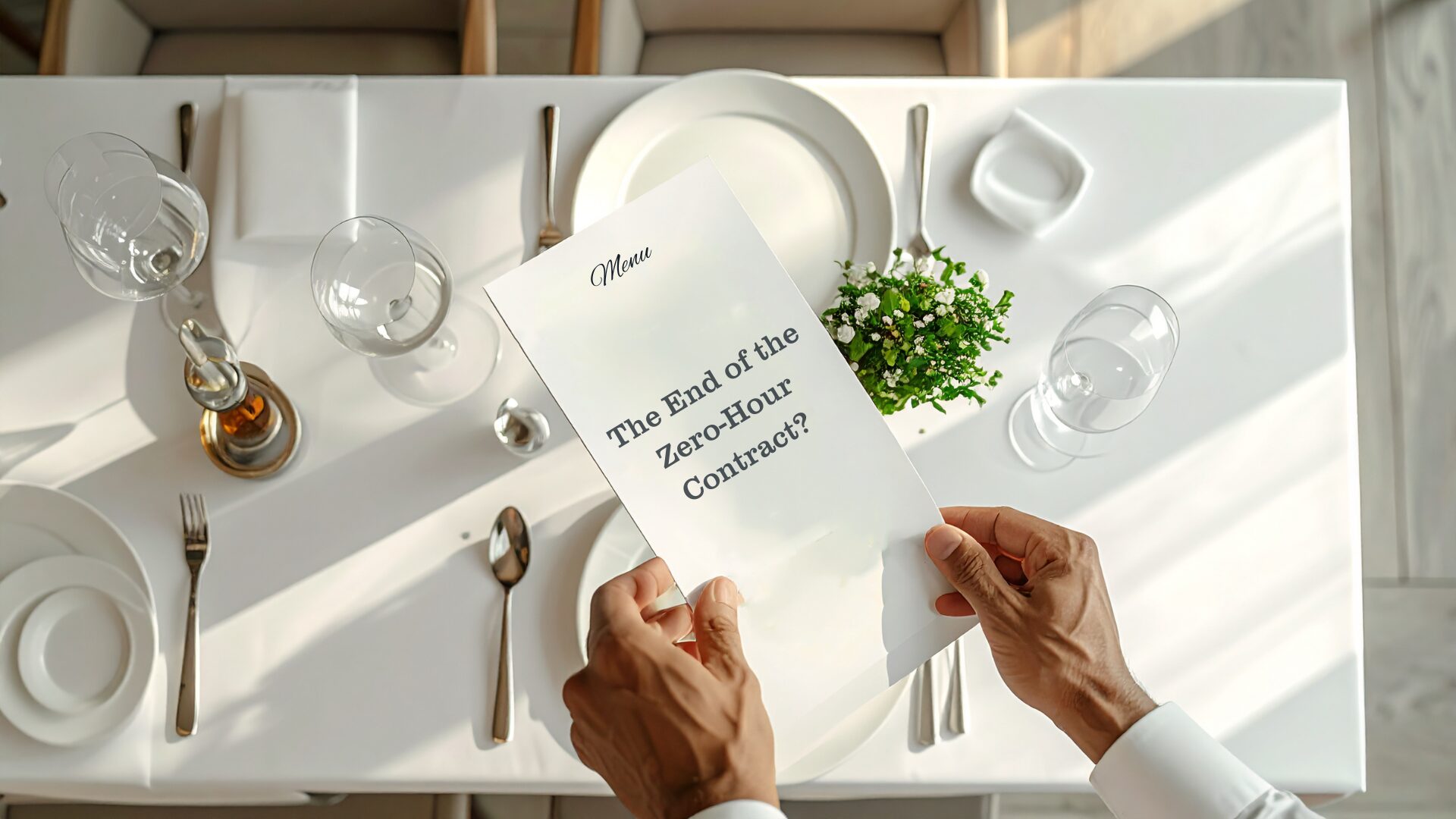 A waiter places a menu on the table with the words 'End of the zero-hours contract?' written on it to represent how this change will impact the hospitality industry.