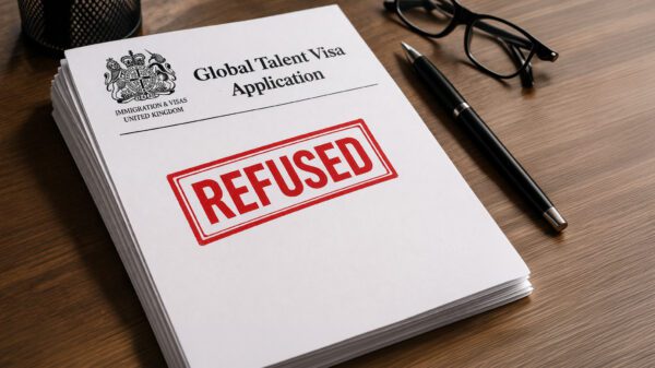 An application for Global Talent Visa sits on a desk. It has the word "refused" stamped across it.